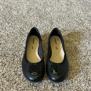 Collection by Clark’s black ballet flats.